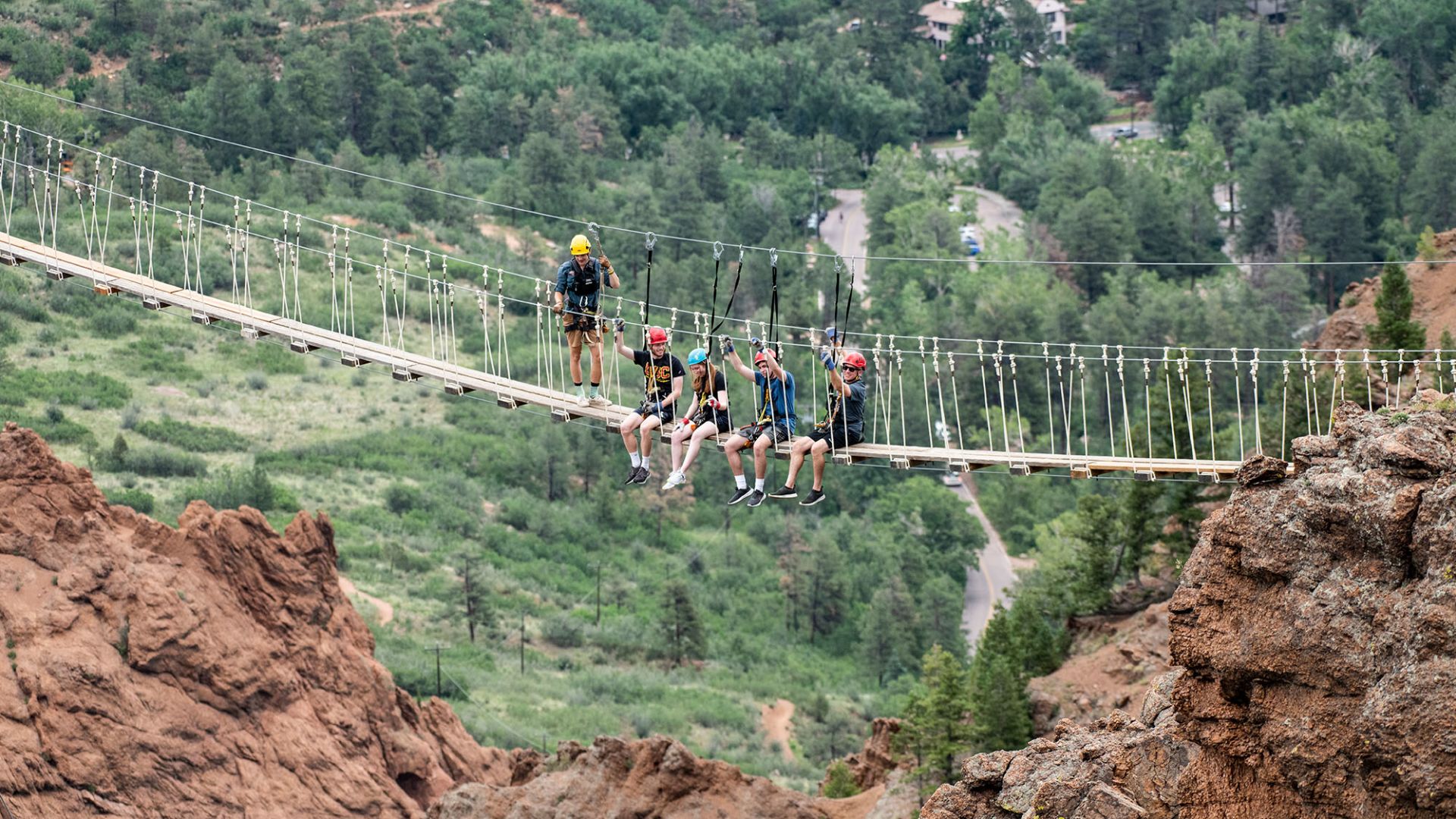A Group Of People Climbing A Mountain